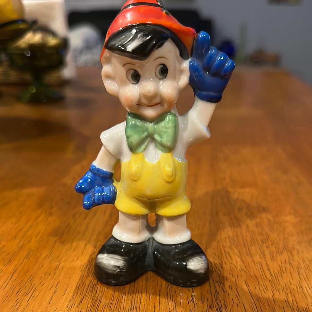 Pinocchio type ceramic salt shaker.